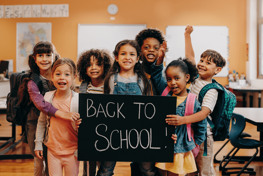 elementary school class with back to school items