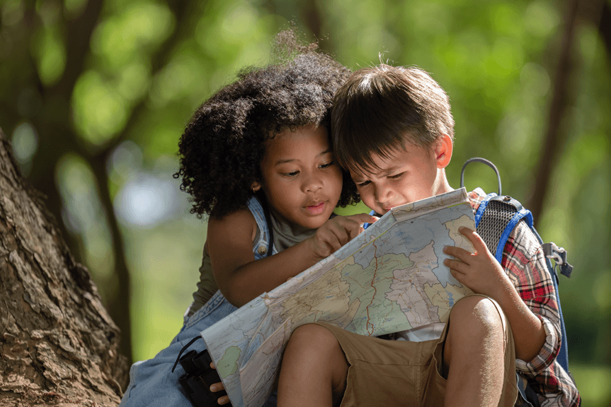 Girl and boy reading a scavenger hunt map