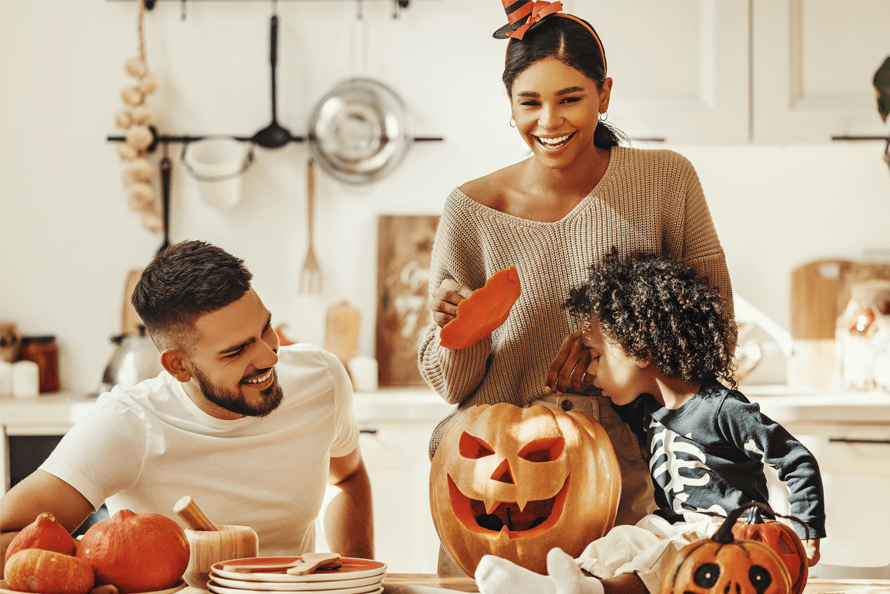 Family preparing Halloween snacks