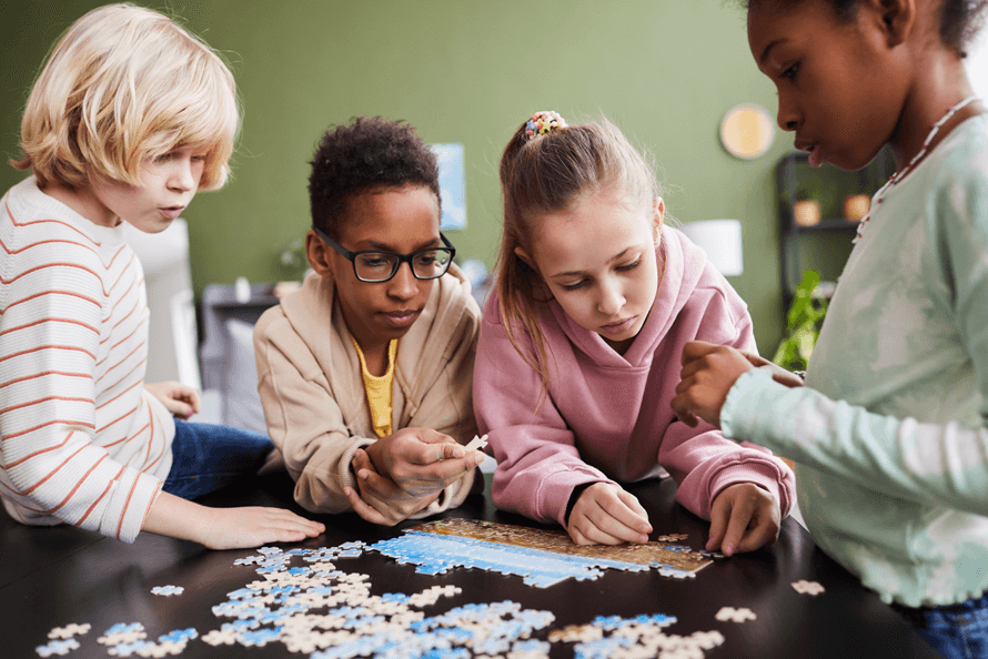 kids working on a puzzle during winter break 