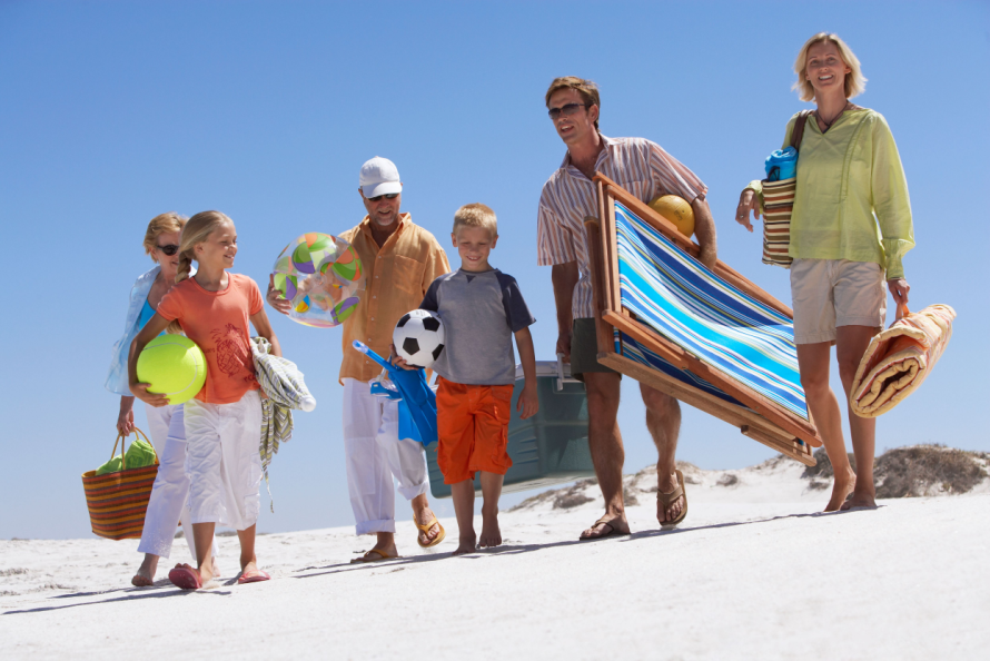 family with beach day essentials