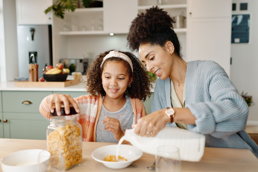 Mom and daughter enjoying fall snacks 